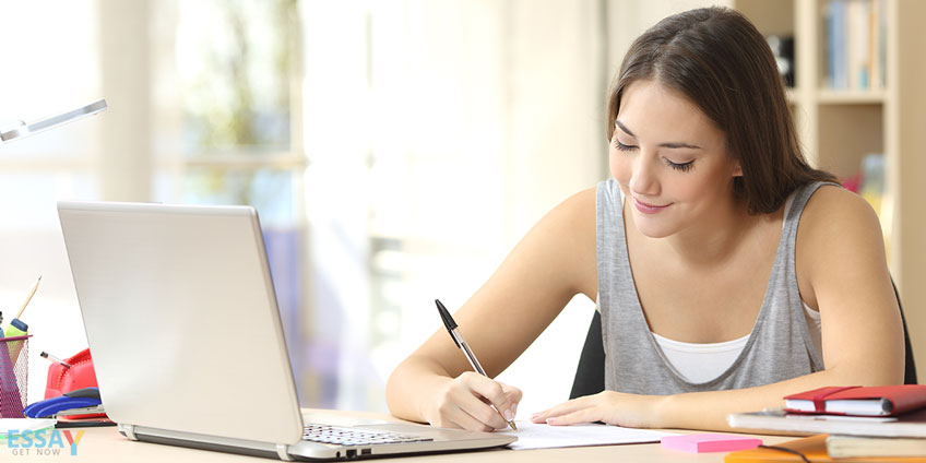 Student Writing on Paper